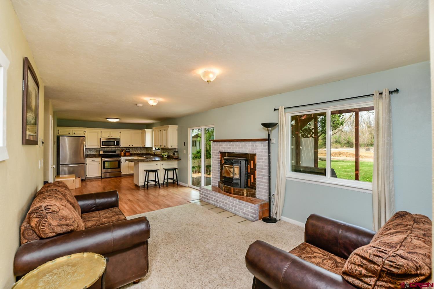 22247 H75 Road Delta, CO 81416 - Photo 20 of 35 a living room with furniture and a fireplace