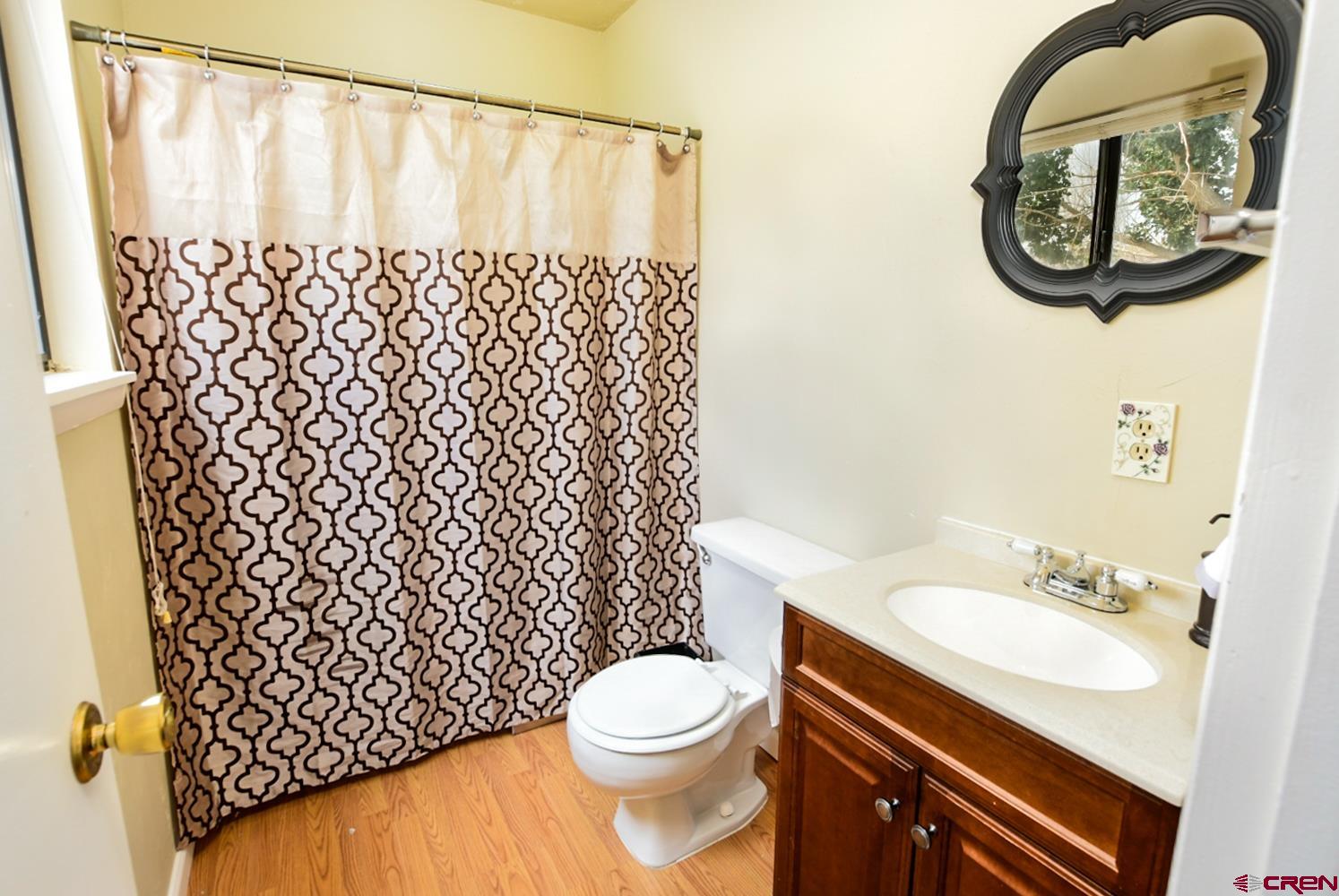 22247 H75 Road Delta, CO 81416 - Photo 22 of 35 a bathroom with a sink toilet and a shower