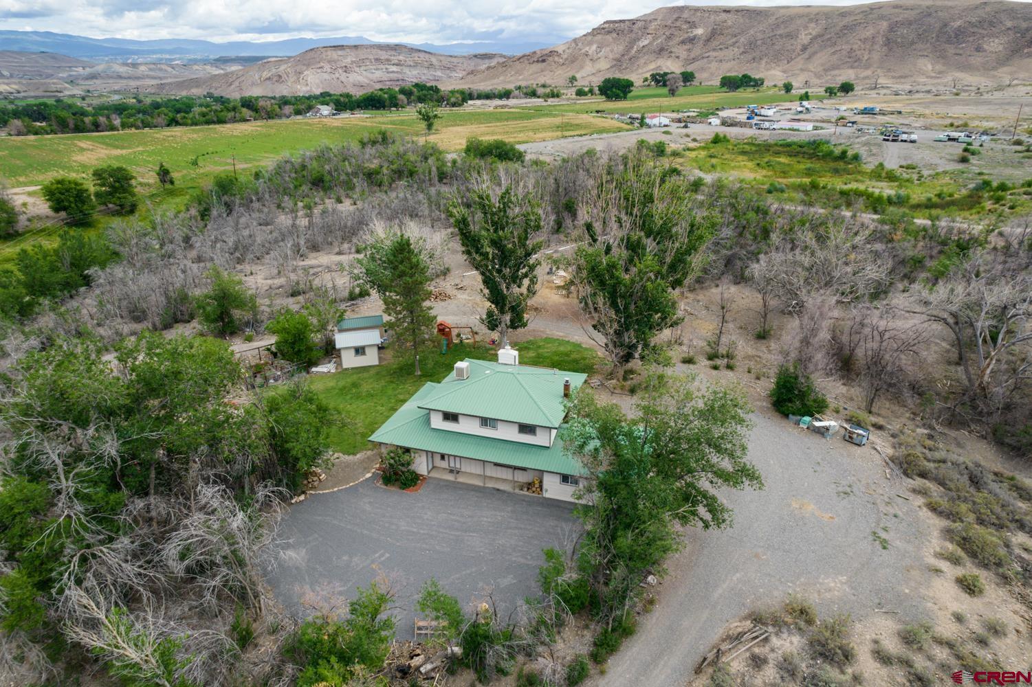 22247 H75 Road Delta, CO 81416 - Photo 33 of 35 an aerial view of a house with a yard
