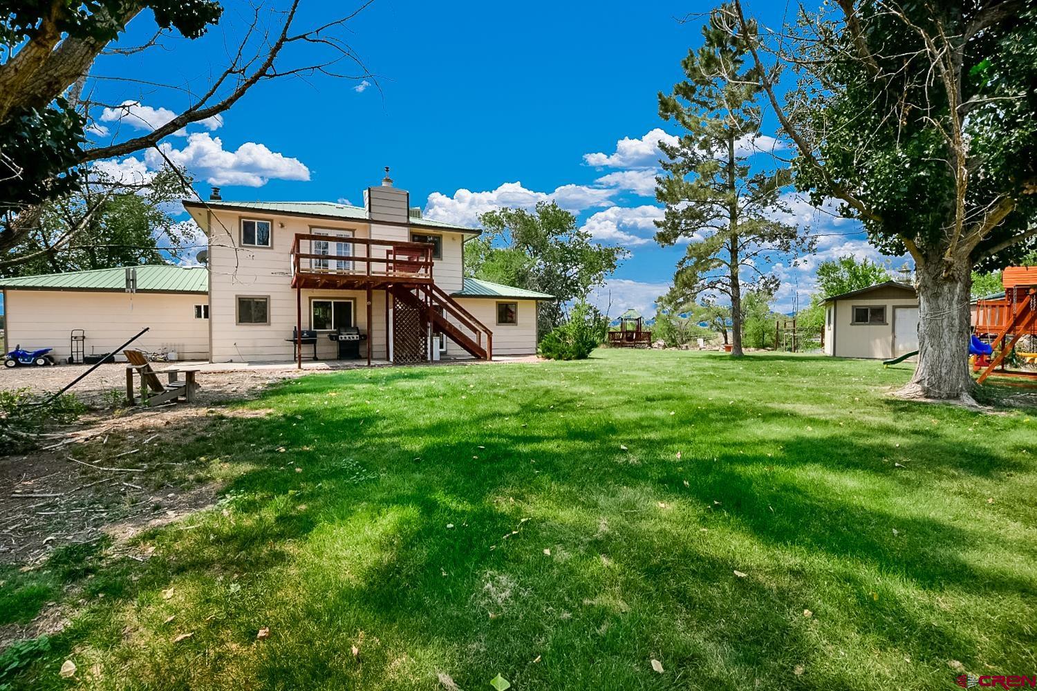 22247 H75 Road Delta, CO 81416 - Photo 6 of 35 a view of a house with a big yard