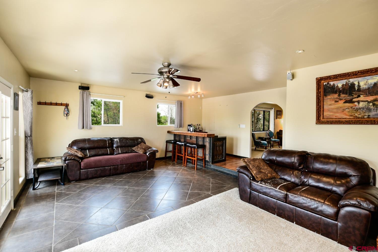 22247 H75 Road Delta, CO 81416 - Photo 9 of 35 a living room with furniture and a flat screen tv
