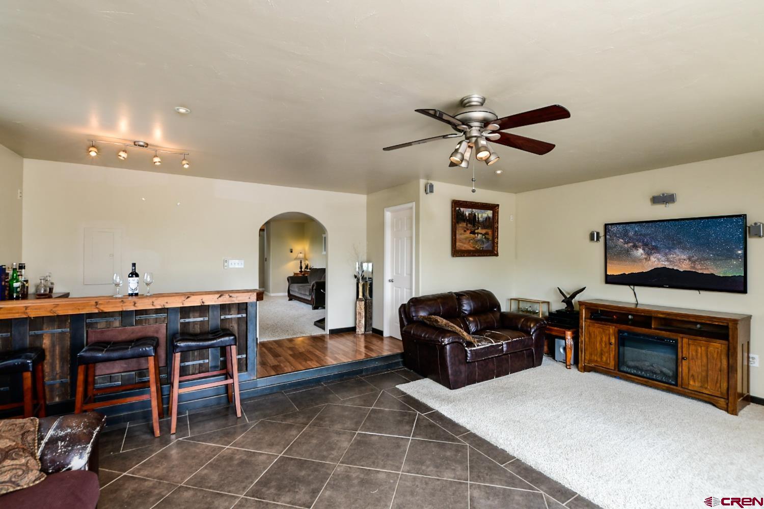 22247 H75 Road Delta, CO 81416 - Photo 10 of 35 a living room with furniture and a fireplace