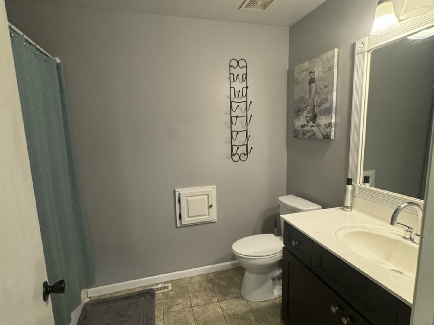 4050 Ridge Road Zion, IL 60099 - Photo 3 of 10 a bathroom with a sink mirror vanity and a toilet
