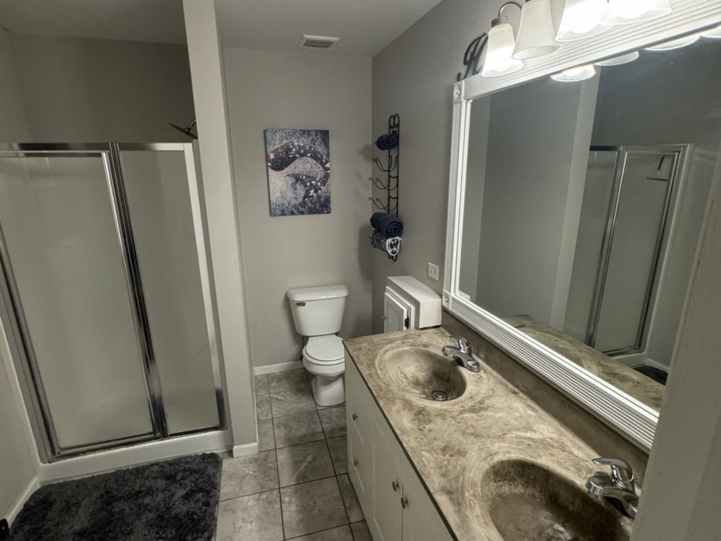 4050 Ridge Road Zion, IL 60099 - Photo 5 of 10 a bathroom with a granite countertop sink toilet and shower