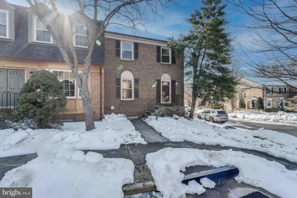 a view of a house with a snow in the background