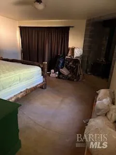 a bed sitting in a room next to a window