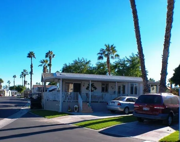 a view of house with outdoor space and swimming pool