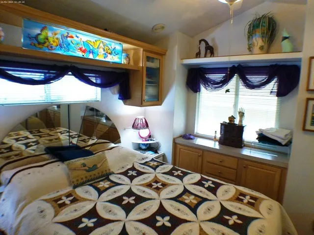 a kitchen with a stove and a wooden floor