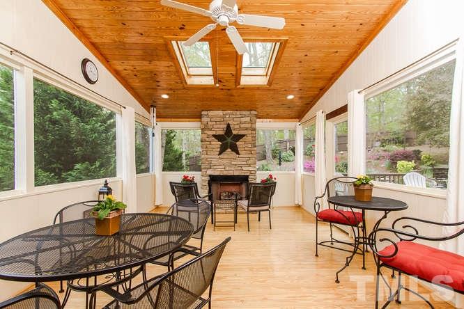 7701 Wilderness Road Raleigh, NC 27613 - Photo 21 of 25 a view of a dining room with furniture window and outside view