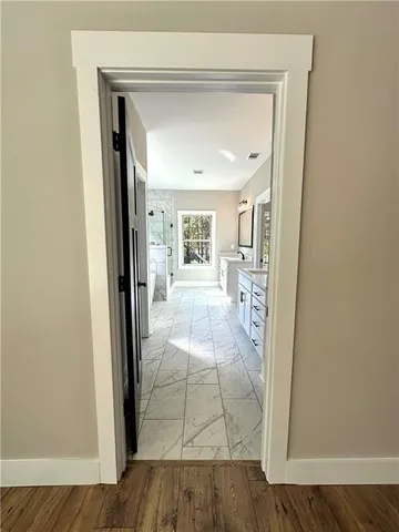 a large bathroom with a glass door shower and sink