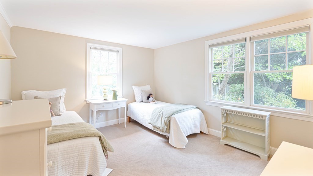 84 Wildwood Drive Needham, MA 02492 - Photo 15 of 36 a bedroom with bed and a large window