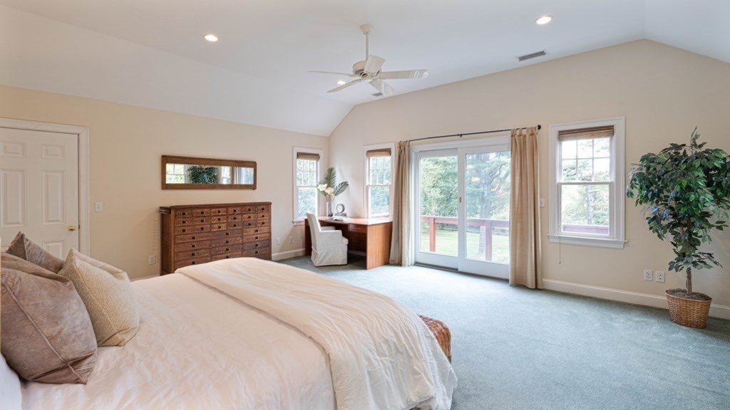 84 Wildwood Drive Needham, MA 02492 - Photo 17 of 36 a spacious bedroom with a large bed and a window