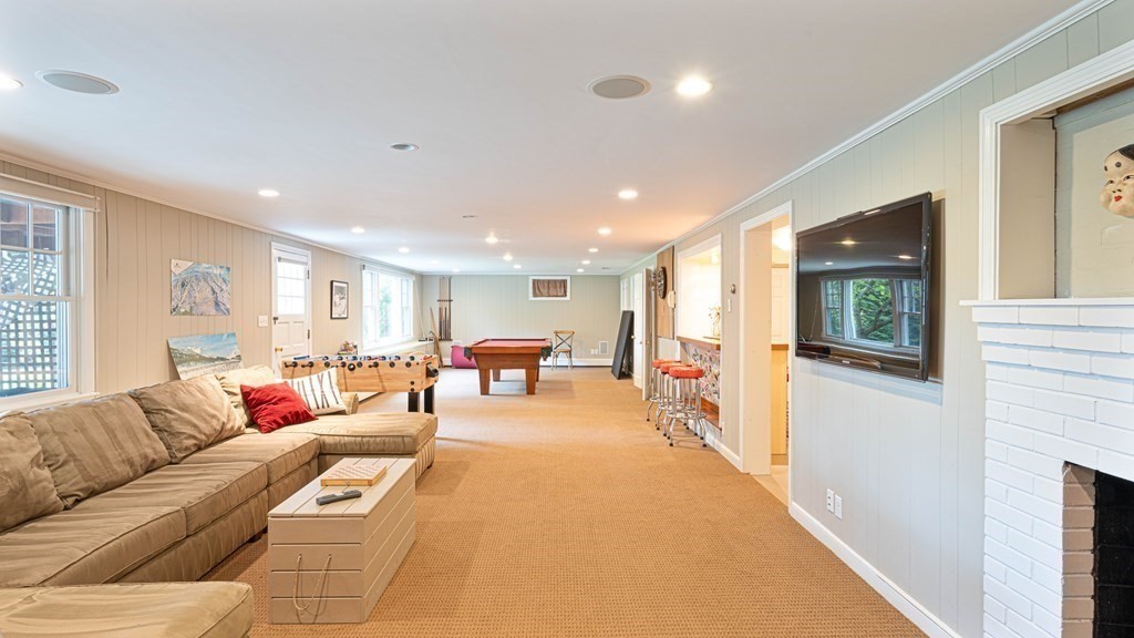 84 Wildwood Drive Needham, MA 02492 - Photo 19 of 36 a living room with furniture and a window
