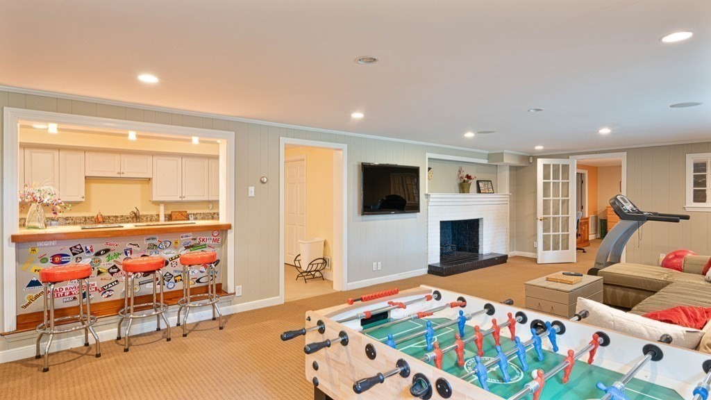 84 Wildwood Drive Needham, MA 02492 - Photo 21 of 36 a bedroom with furniture and a flat screen tv