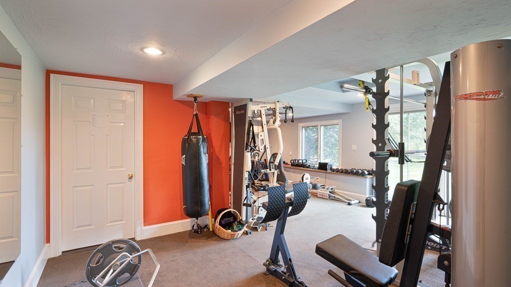 84 Wildwood Drive Needham, MA 02492 - Photo 22 of 36 a view of a room with gym equipment