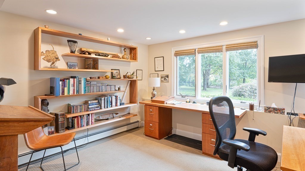 84 Wildwood Drive Needham, MA 02492 - Photo 23 of 36 a view of a workspace with furniture and a window