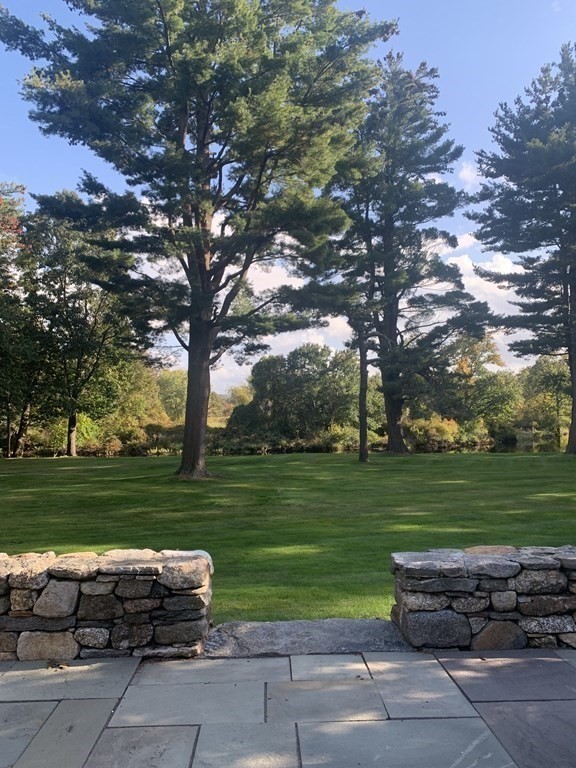 84 Wildwood Drive Needham, MA 02492 - Photo 25 of 36 a view of a park with big trees