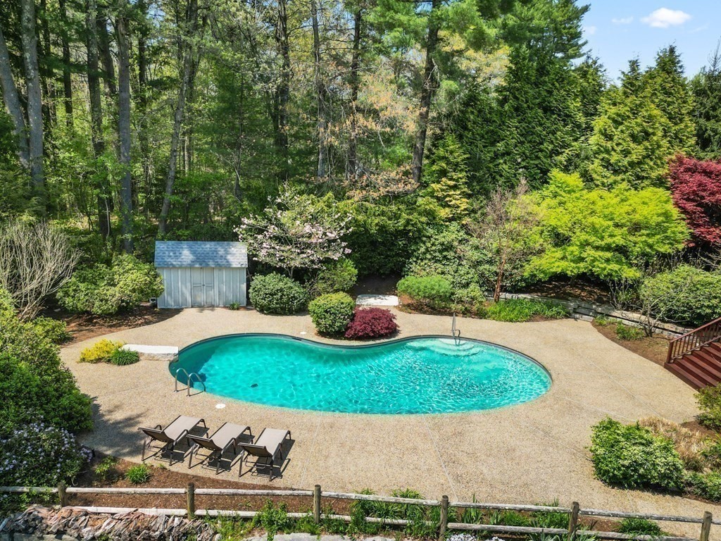 84 Wildwood Drive Needham, MA 02492 - Photo 28 of 36 a view of a swimming pool with a yard