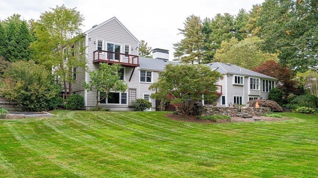84 Wildwood Drive Needham, MA 02492 - Photo 30 of 36 a house view with a sitting space and garden