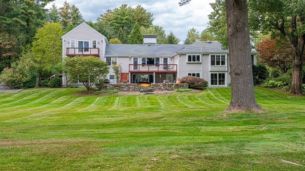 84 Wildwood Drive Needham, MA 02492 - Photo 31 of 36 a view of a house with a big yard patio and swimming pool