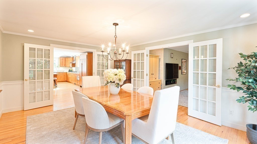 84 Wildwood Drive Needham, MA 02492 - Photo 8 of 36 a view of a dining room with furniture and wooden floor