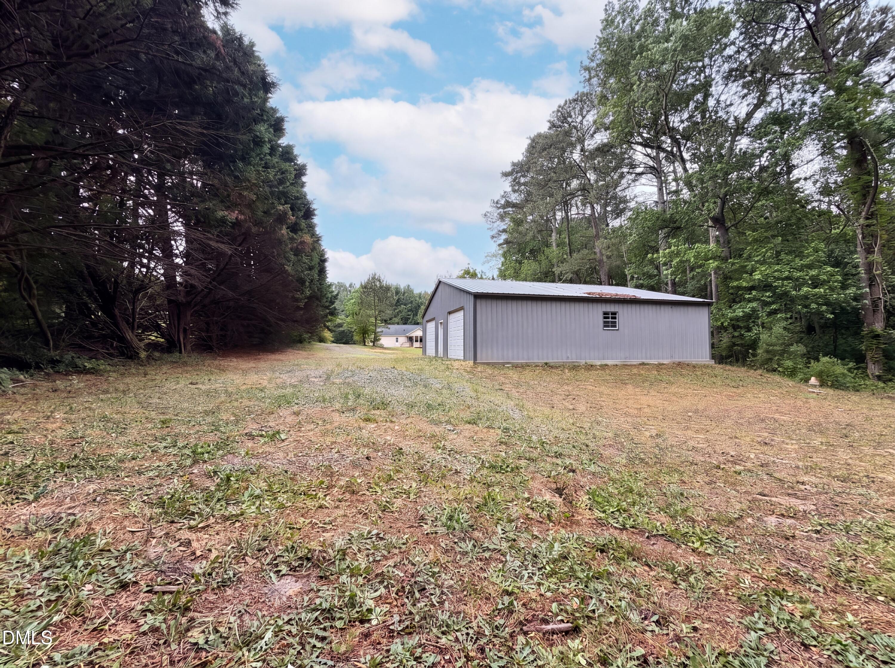 4894 Elevation Road, Unit C Benson, NC 27504 - Photo 23 of 24 a house view with a garden space