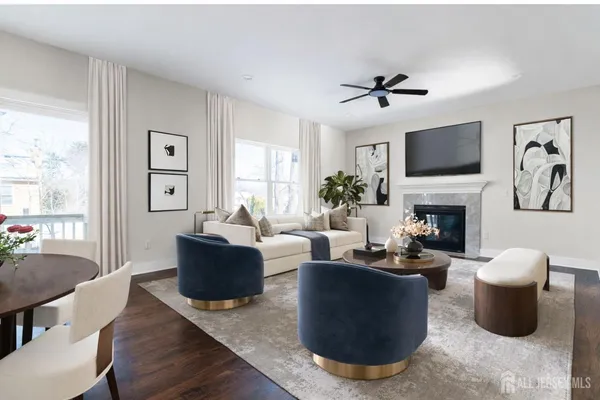 an empty room with wooden floor chandelier and windows