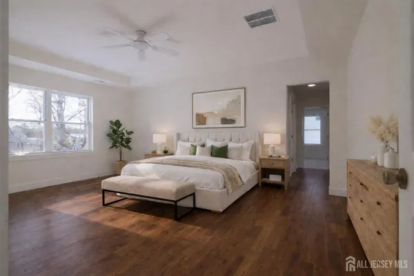 a view of a workspace with furniture and a potted plant
