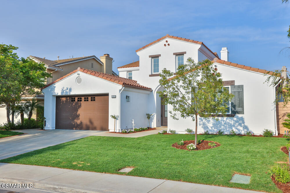 4630 Rio Bravo Court Moorpark, CA 93021 - Photo 3 of 58 a front view of a house with a yard and garage
