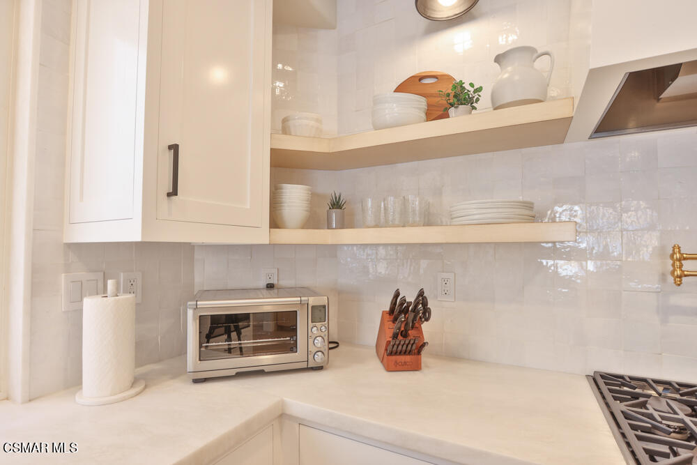 4630 Rio Bravo Court Moorpark, CA 93021 - Photo 27 of 58 a kitchen with a sink and cabinets