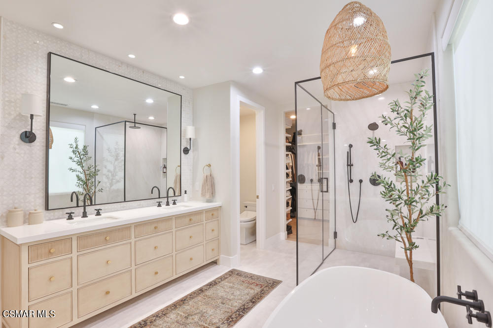 4630 Rio Bravo Court Moorpark, CA 93021 - Photo 37 of 58 a spacious bathroom with a double vanity sink mirror and shower