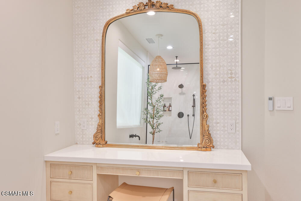 4630 Rio Bravo Court Moorpark, CA 93021 - Photo 38 of 58 a bathroom with a sink and a mirror