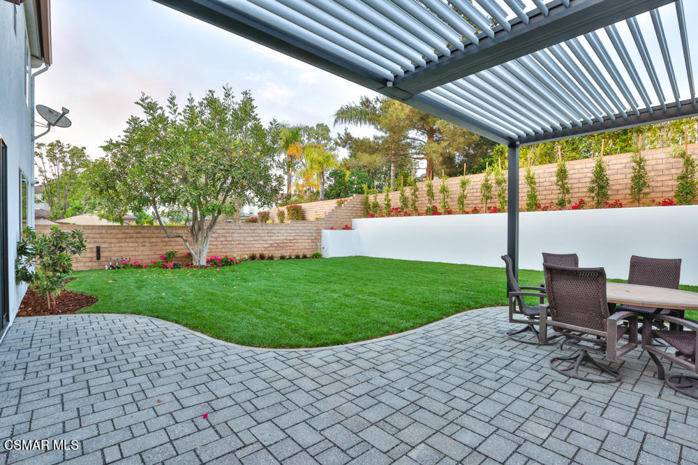 4630 Rio Bravo Court Moorpark, CA 93021 - Photo 48 of 58 a view of a patio with table and chairs and potted plants