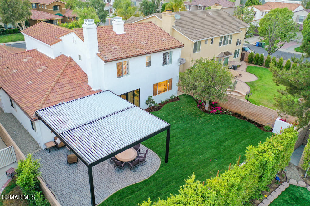 4630 Rio Bravo Court Moorpark, CA 93021 - Photo 55 of 58 an aerial view of a house with a yard table and chairs