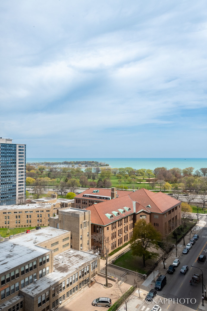 655 West Irving Park Road, Unit 1505 Chicago, IL 60613 - Photo 22 of 26 an aerial view of residential building and ocean view in back