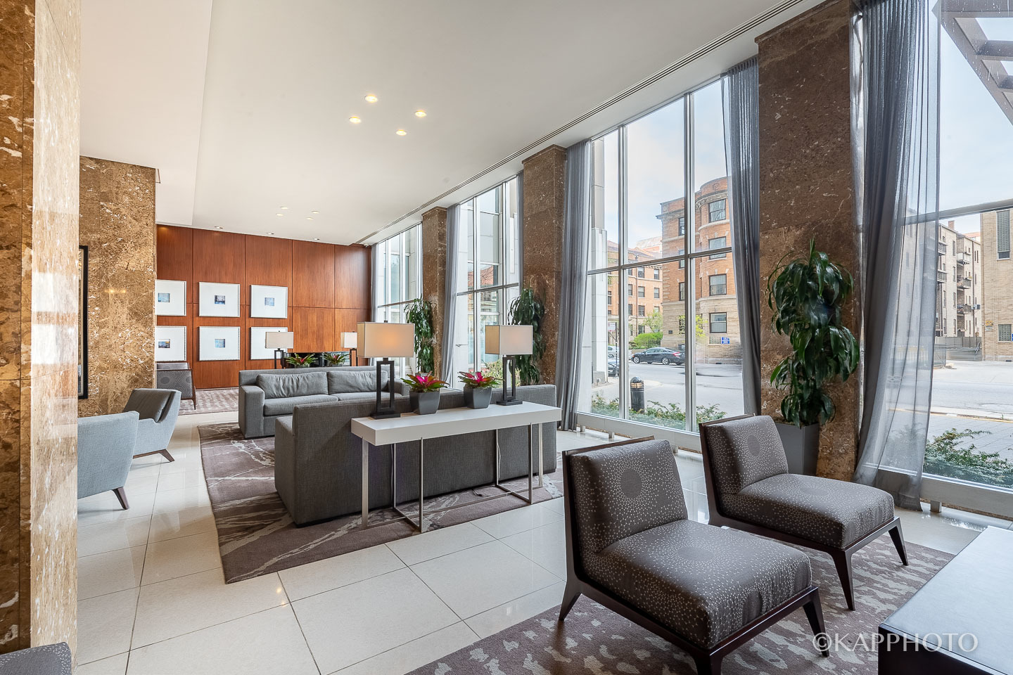 655 West Irving Park Road, Unit 1505 Chicago, IL 60613 - Photo 25 of 26 a living room with furniture large windows and wooden floor