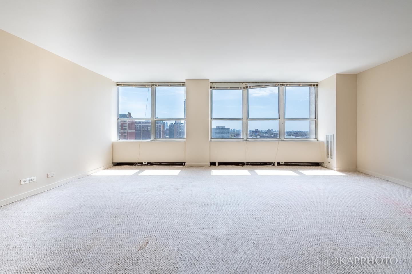 655 West Irving Park Road, Unit 1505 Chicago, IL 60613 - Photo 7 of 26 an empty room with windows