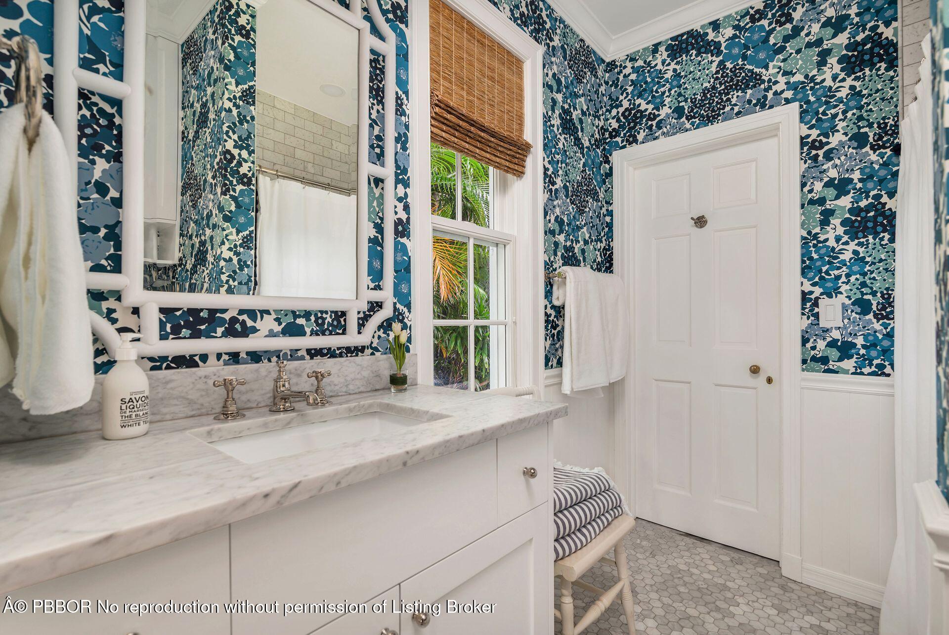 255 Colonial Lane Palm Beach, FL 33480 - Photo 18 of 32 a bathroom with a sink and a mirror