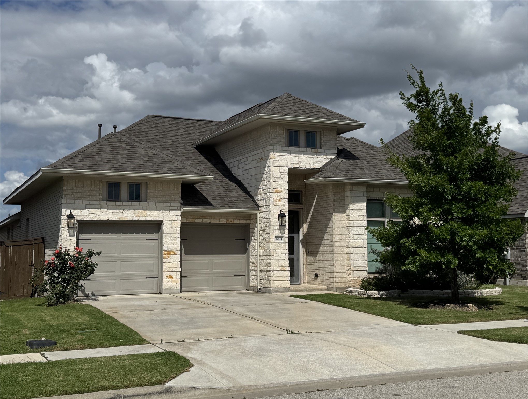 2004 Stirling Street Leander, TX 78641 - Photo 1 of 16 a front view of a house with a yard