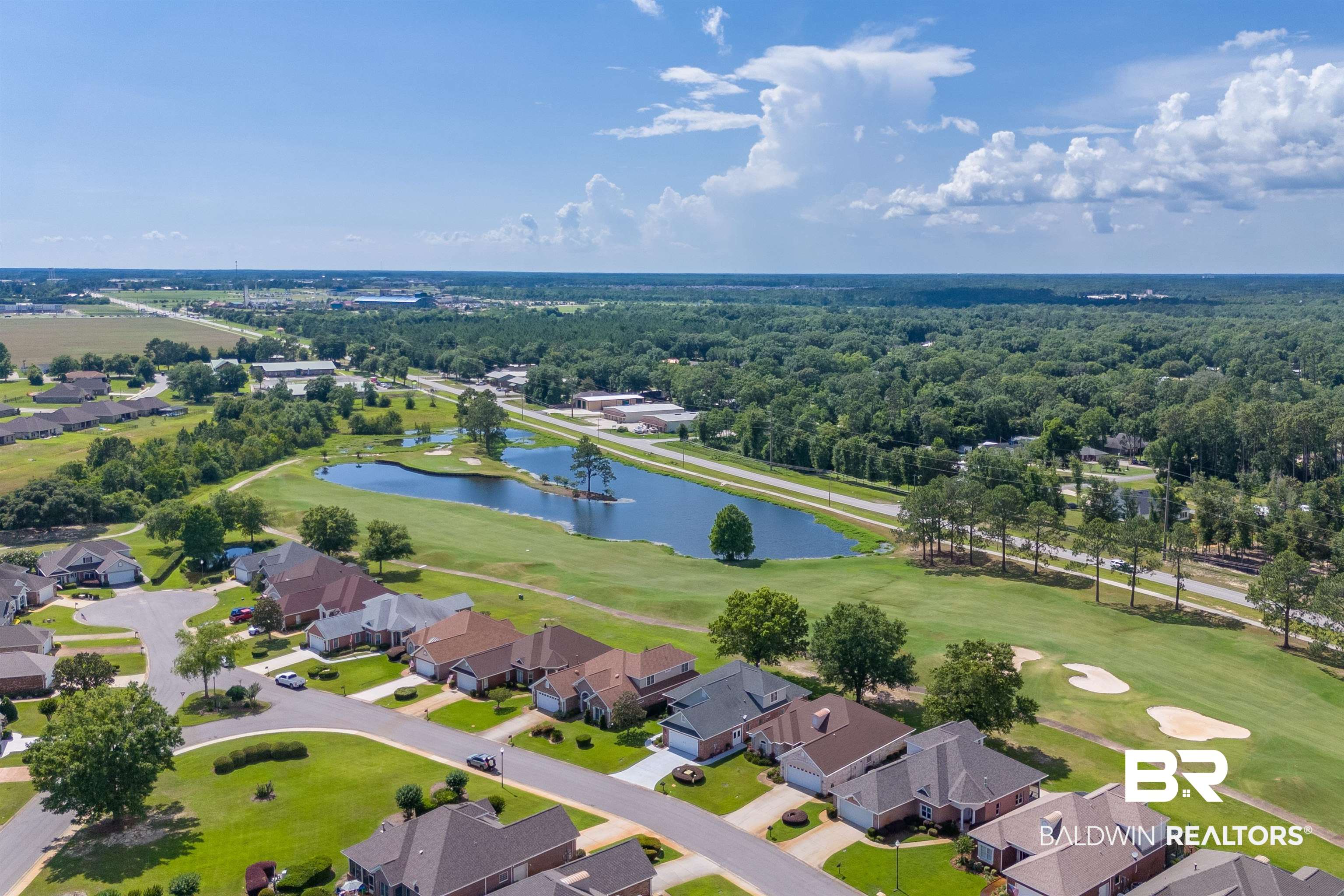 22739 Inverness Way Foley, AL 36535 - Photo 64 of 80 Aerial perspective of suburban area featuring a nearby body of water and a local golf course