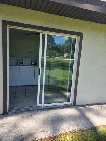 a view of a glass door of the house