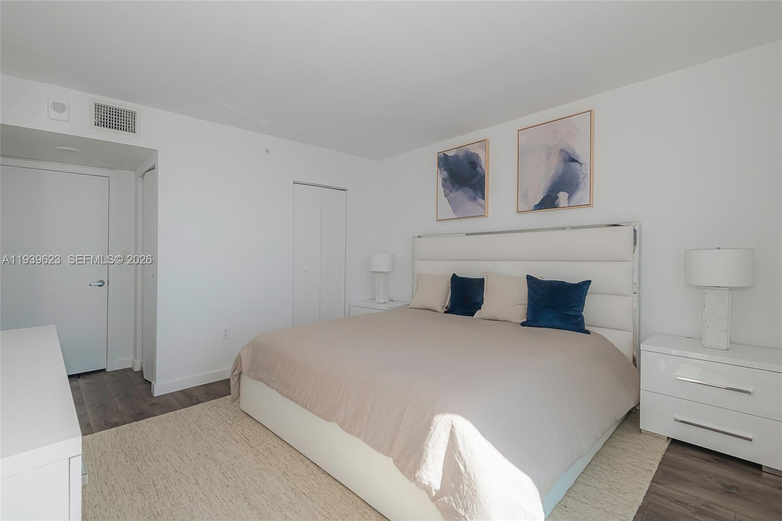 90 Alton Road, Unit 2008 Miami Beach, FL 33139 - Photo 21 of 28 a bedroom with a bed and closet