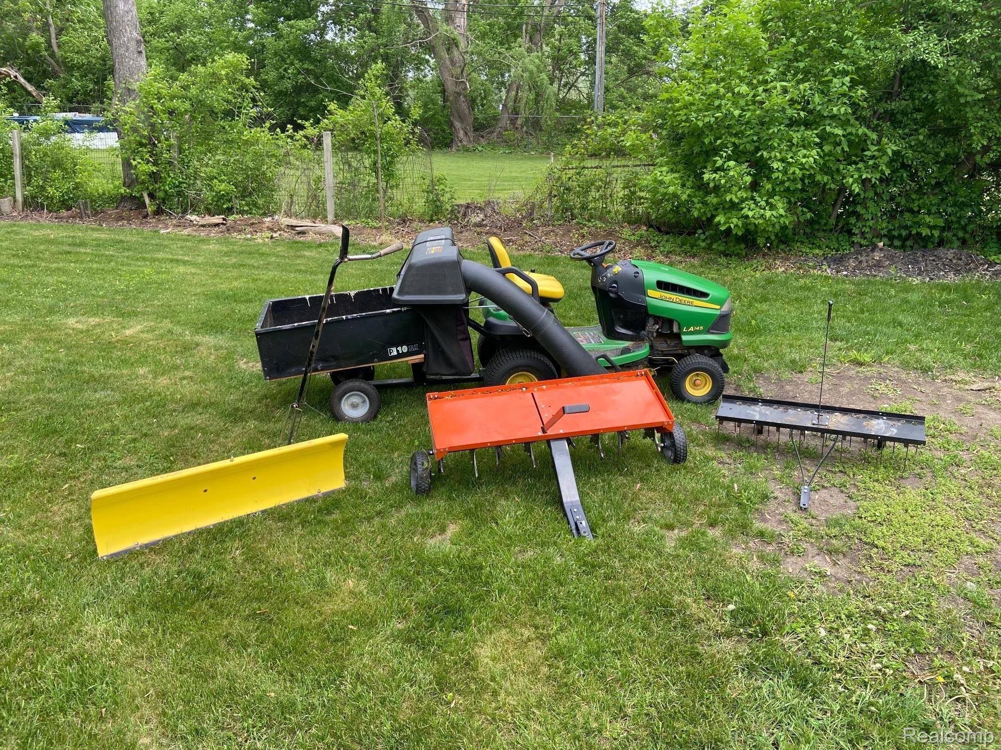 1155 Michelson Road Rochester, MI 48307 - Photo 36 of 36 Included tractor, de-thatcher, and snow plow.