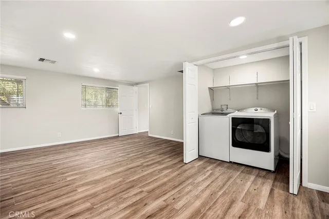 a view of a kitchen with a sink and a stove top oven