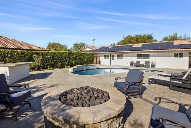 a view of a terrace with furniture and a table