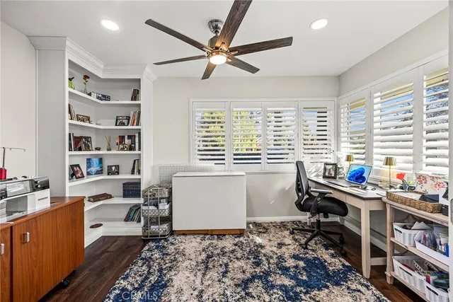 a room that has a lot of furniture and a window