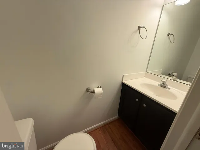 a bathroom with a sink toilet and vanity