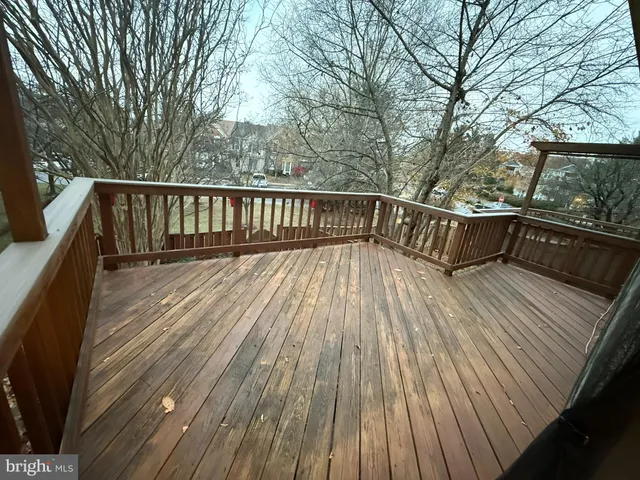 a view of balcony with wooden floor and outdoor space