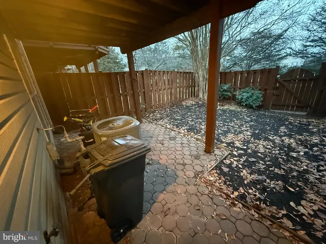 a view of a backyard with chairs