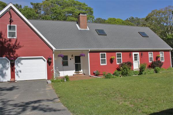 108 Telegraph Road Dennis, MA 02639 - Photo 1 of 19 a front view of house with yard and green space